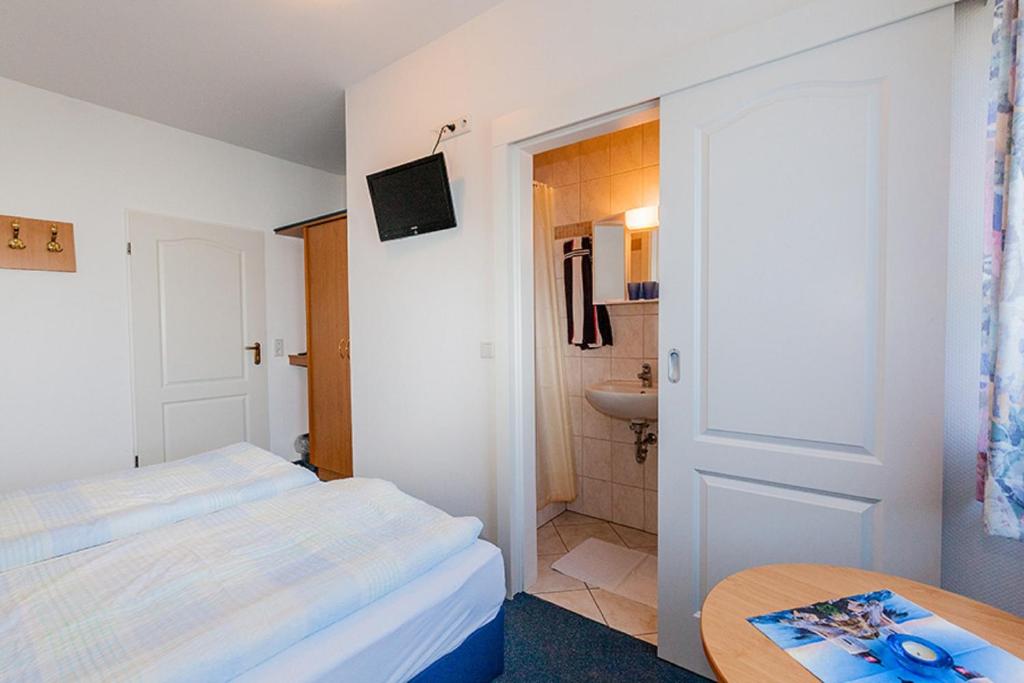 Postel nebo postele na pokoji v ubytování Hotel Kiek ut