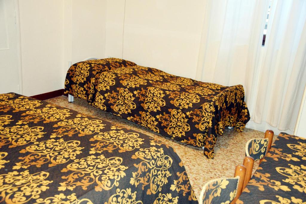 Postel nebo postele na pokoji v ubytování Venice Rainbow Apartment San Marco