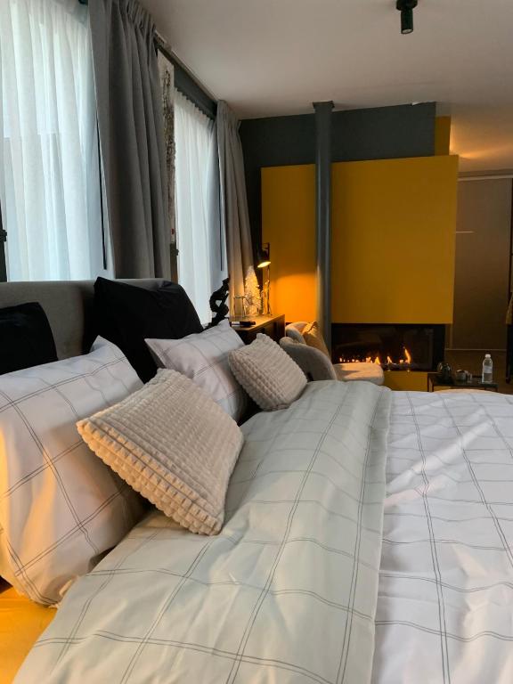 Postel nebo postele na pokoji v ubytování Guestsuite The Nest
