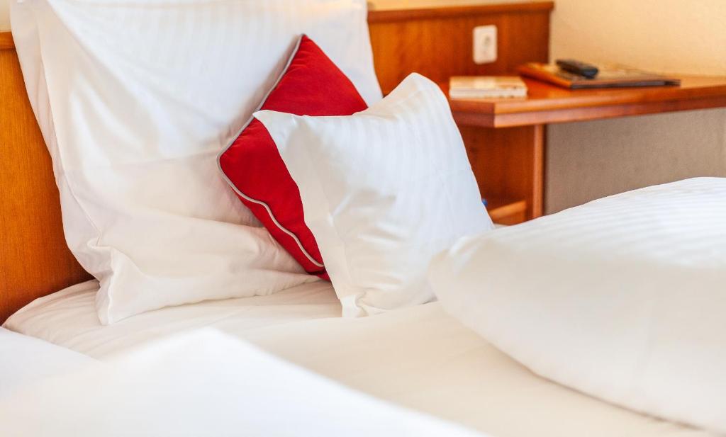 Postel nebo postele na pokoji v ubytování Hotel Friese