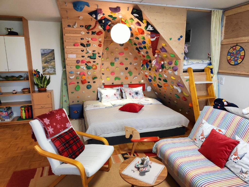 a room with a bed and a climbing wall at Apartma Velesa in Rače