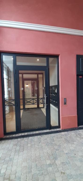 an entrance to a building with glass doors at Disney best location &amp; confortable 4 beds - All by feet in Serris