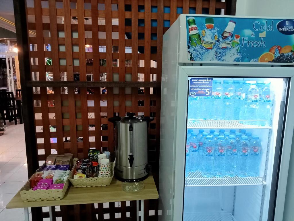 a refrigerator filled with bottles of water at TIKI HOSTEL in Haad Rin