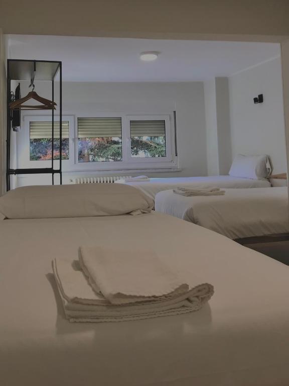 Letto o letti in una camera di Hostal Mindanao