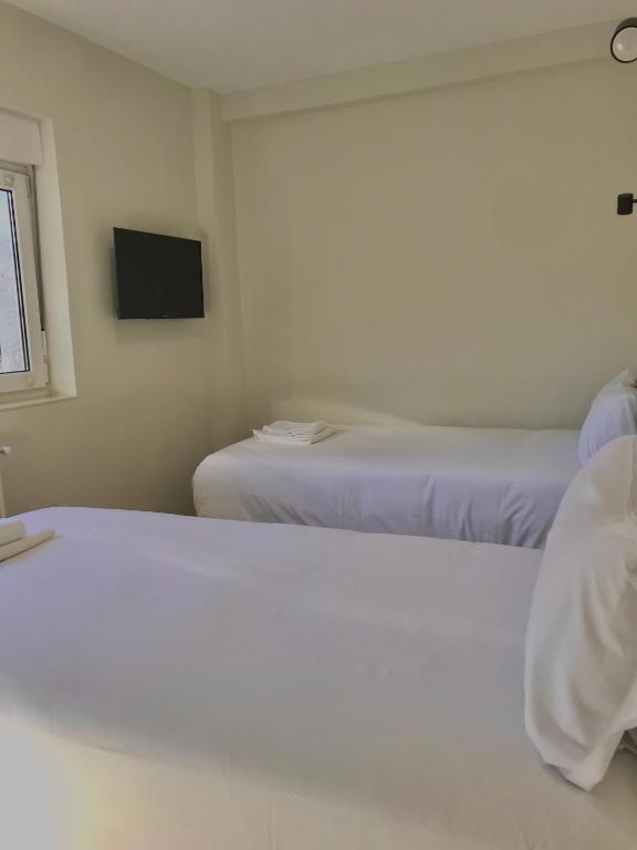 Letto o letti in una camera di Hostal Mindanao