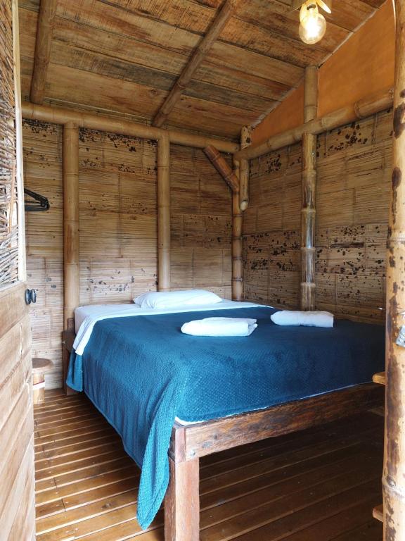 Postel nebo postele na pokoji v ubytování Aracari Ecolodge
