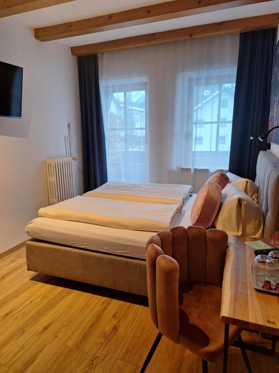 Postel nebo postele na pokoji v ubytování Hotel Post - Garni