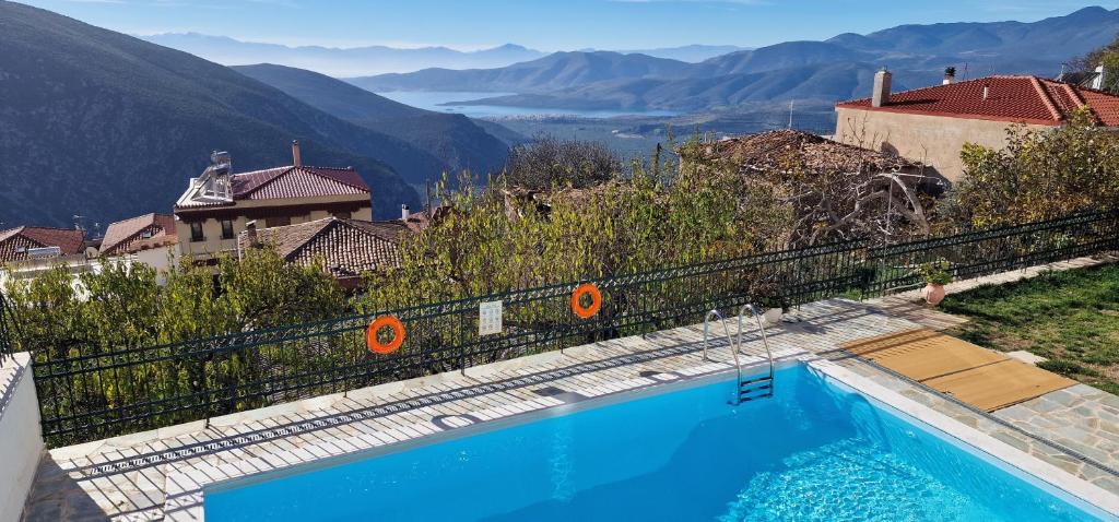 a swimming pool with a view of a mountain at Hotel Apollonia in Delphi