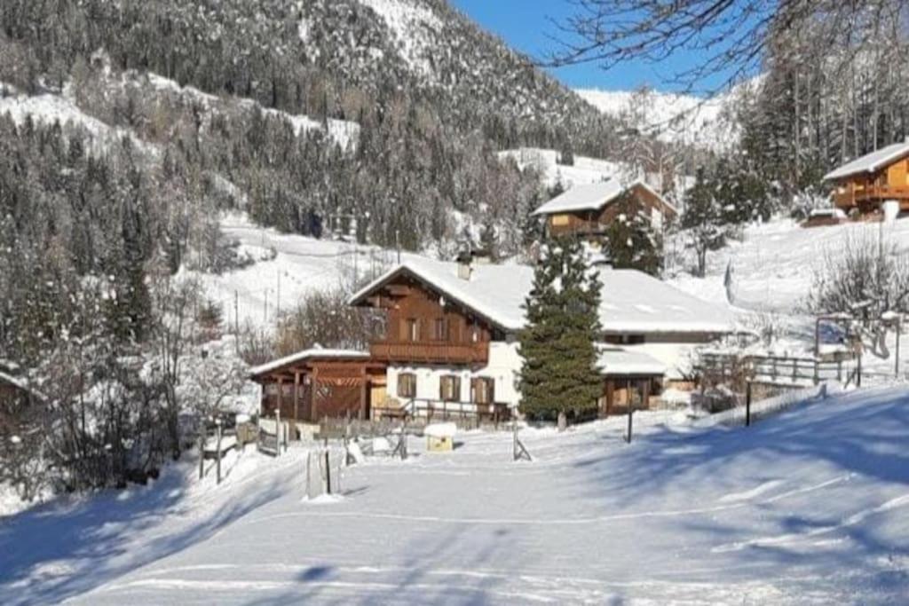 a ski lodge in a snow covered mountain at Maso de Propian in Tesero