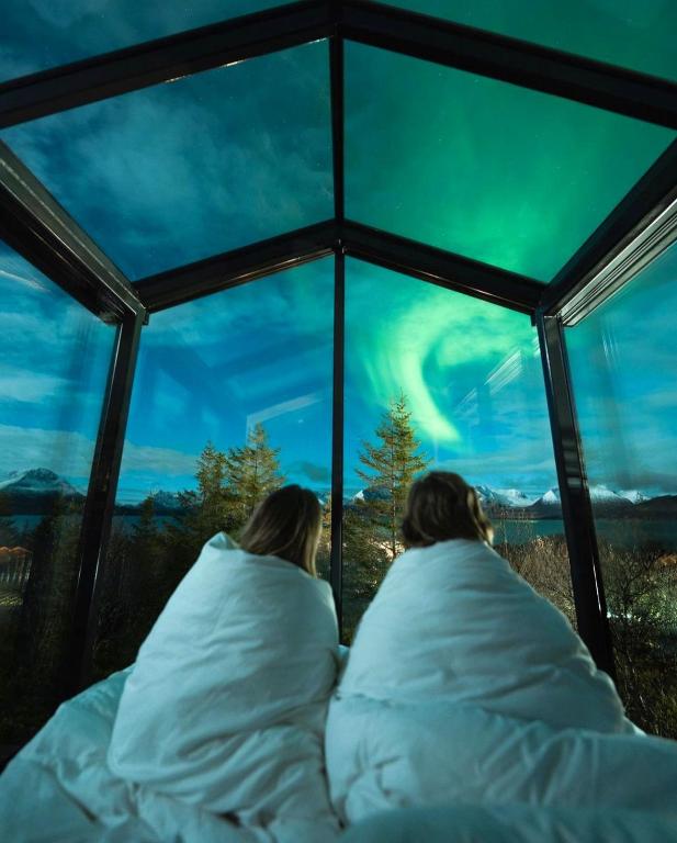 Postel nebo postele na pokoji v ubytování WonderInn Arctic