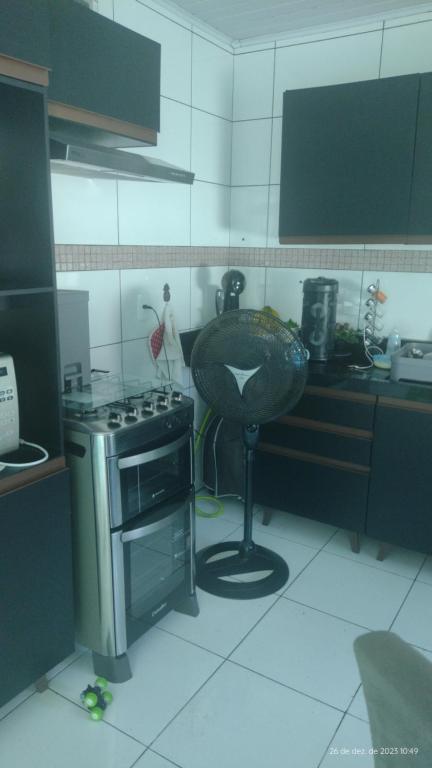 a kitchen with a sink and a stove in it at balneário Camboriú, disponível para carnaval in Balneário Camboriú