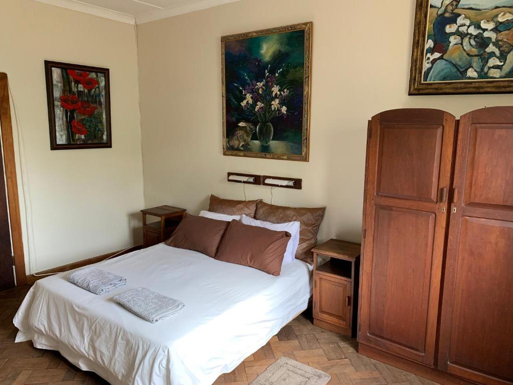 Postel nebo postele na pokoji v ubytování Hotel De Rust
