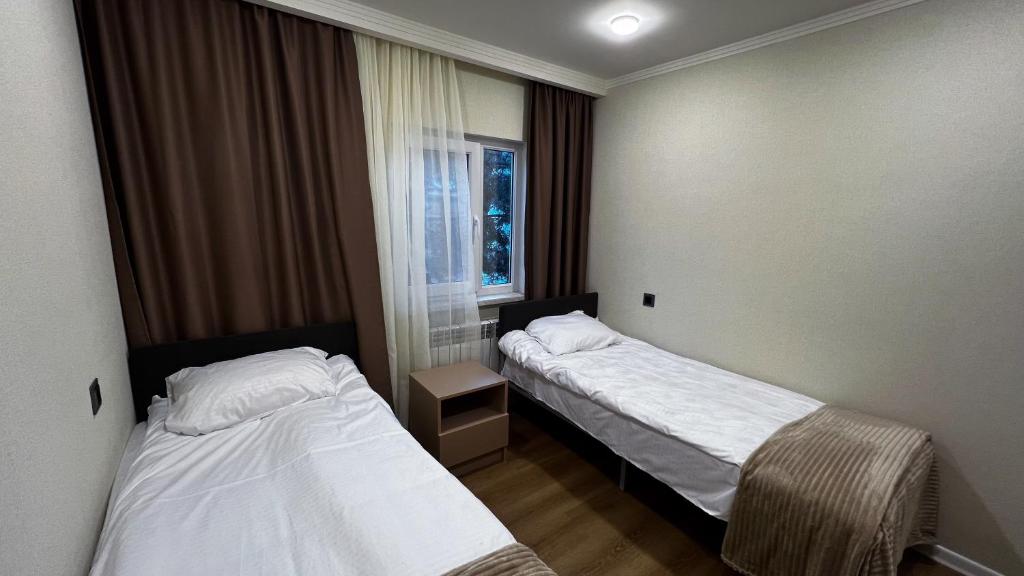 Postel nebo postele na pokoji v ubytování Bellissimo Garden Villa