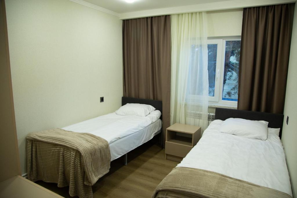 Postel nebo postele na pokoji v ubytování Bellissimo Garden Villa