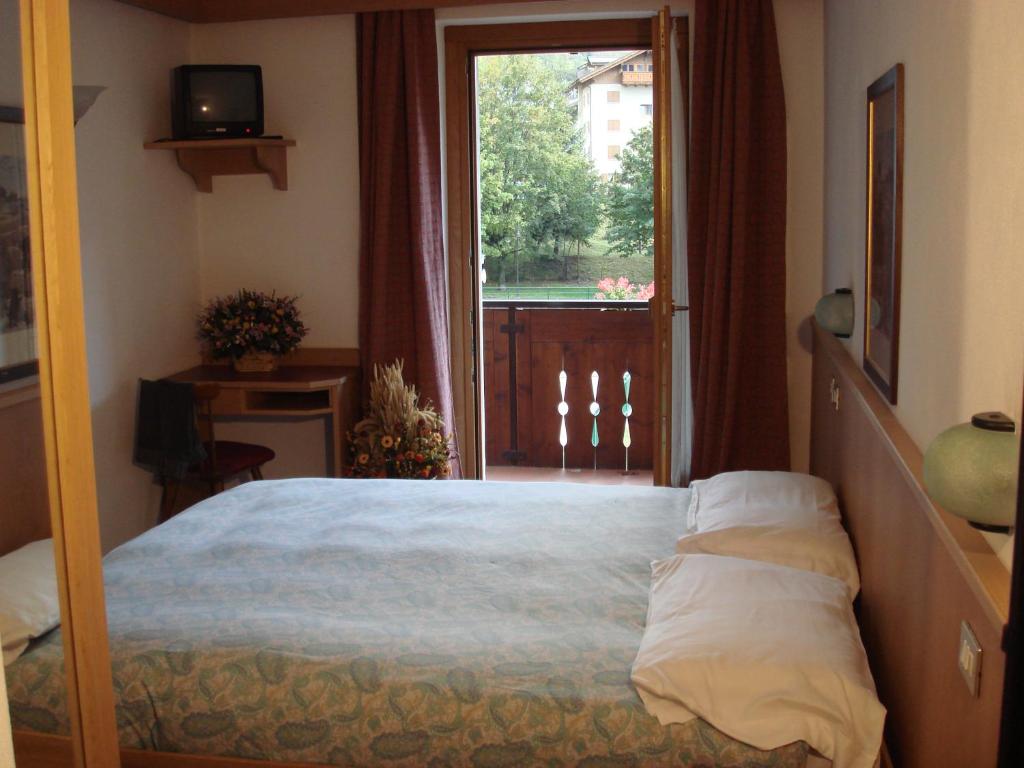 Postel nebo postele na pokoji v ubytování Hotel Derby