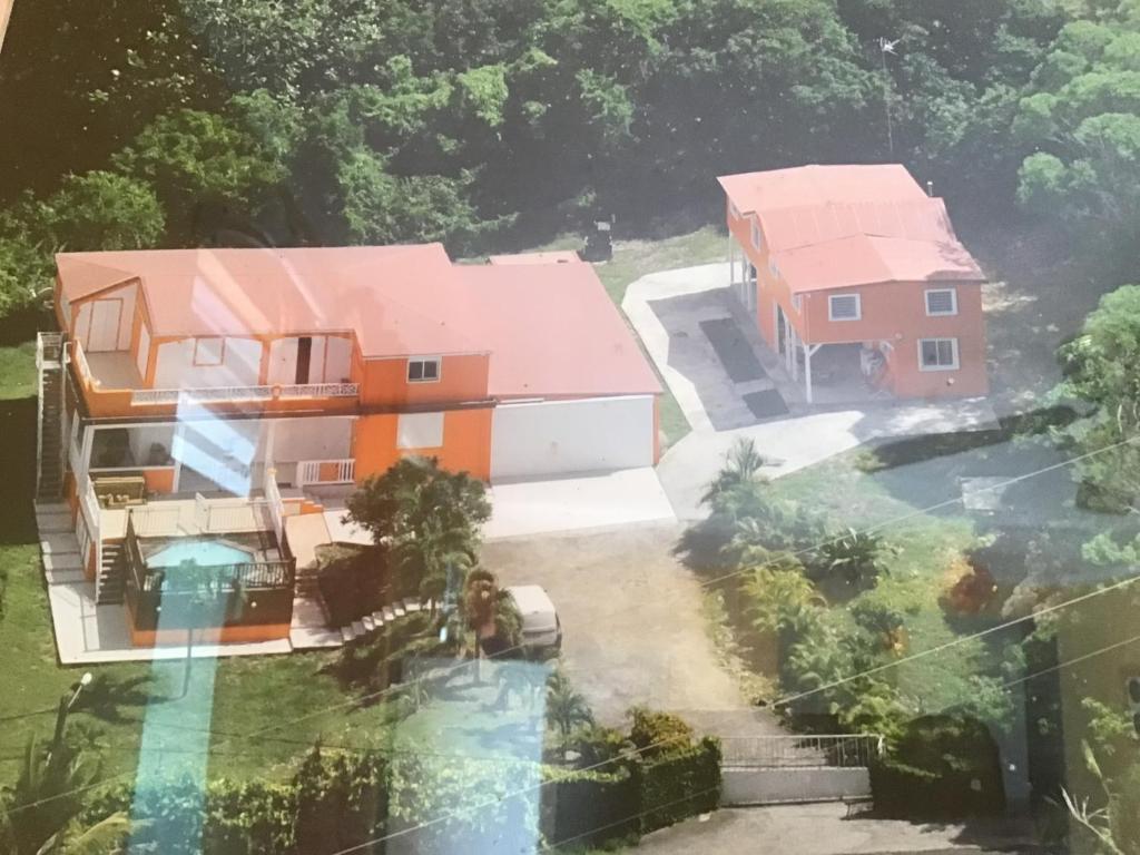 an aerial view of a house with a pool at Location de meublés in Morne-à-lʼEau