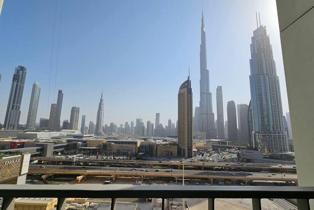 a view of a large city with tall buildings at Luxury 3 Bed + Maid Room in Downtown Apt With Burj Khalifa View in Dubai