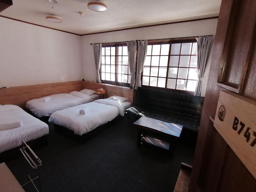 Postel nebo postele na pokoji v ubytování Pilot Lodge
