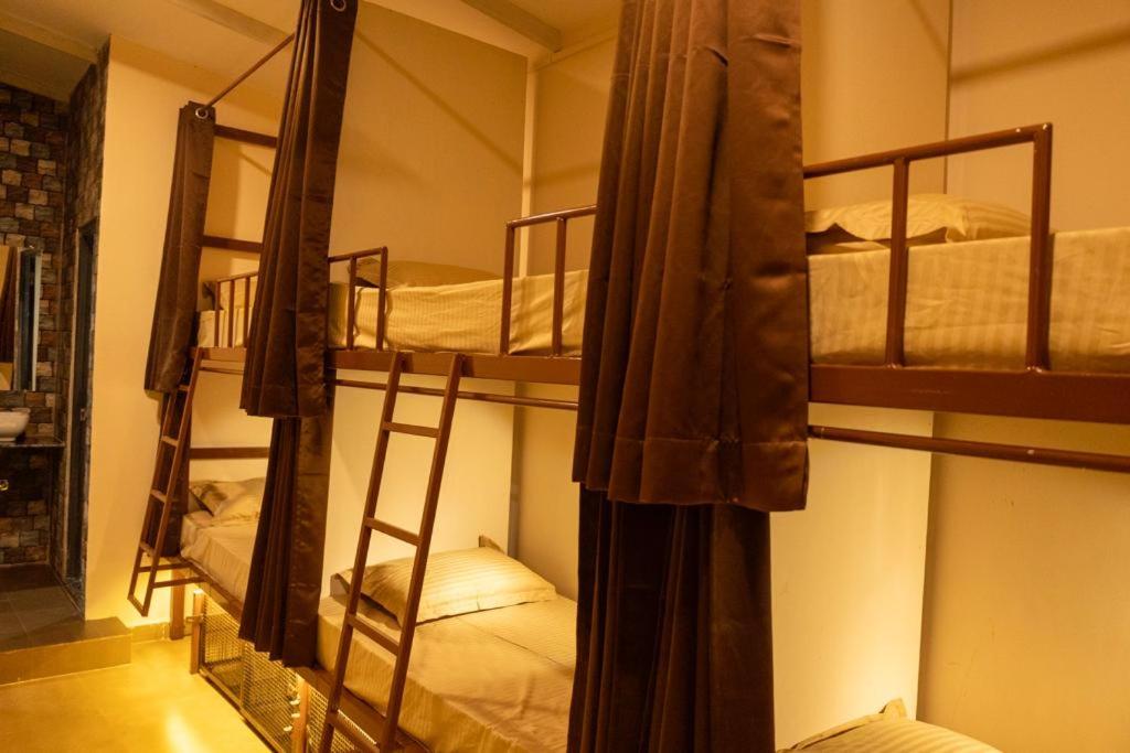 Postel nebo postele na pokoji v ubytování Pappi Chulo Vagator