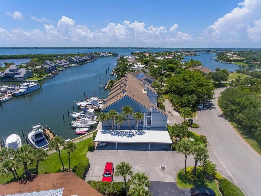an aerial view of a marina with boats in the water at Harbor View, short 7 minute walk to beach. in Vero Beach
