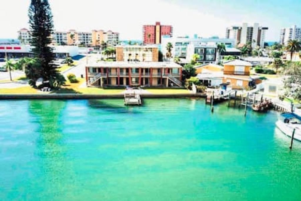 a view of a river with boats in a city at Beautiful Madeira Beach 1 Bed Condo With Boat Dock in St Pete Beach