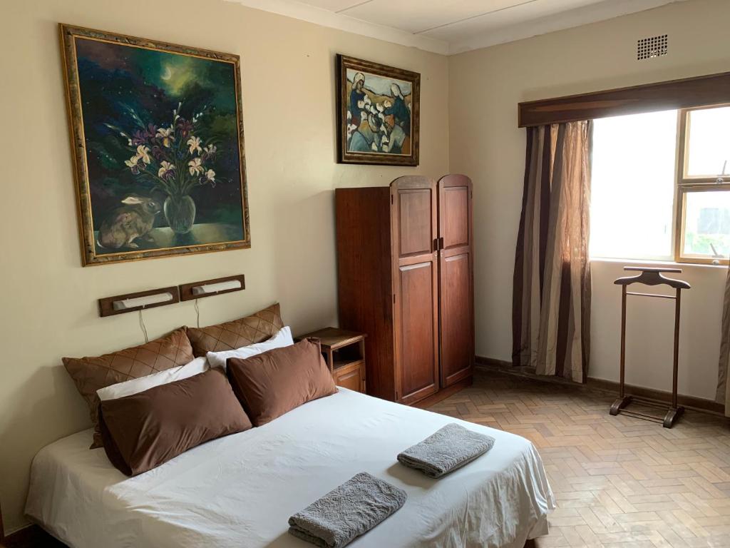 Postel nebo postele na pokoji v ubytování Hotel De Rust