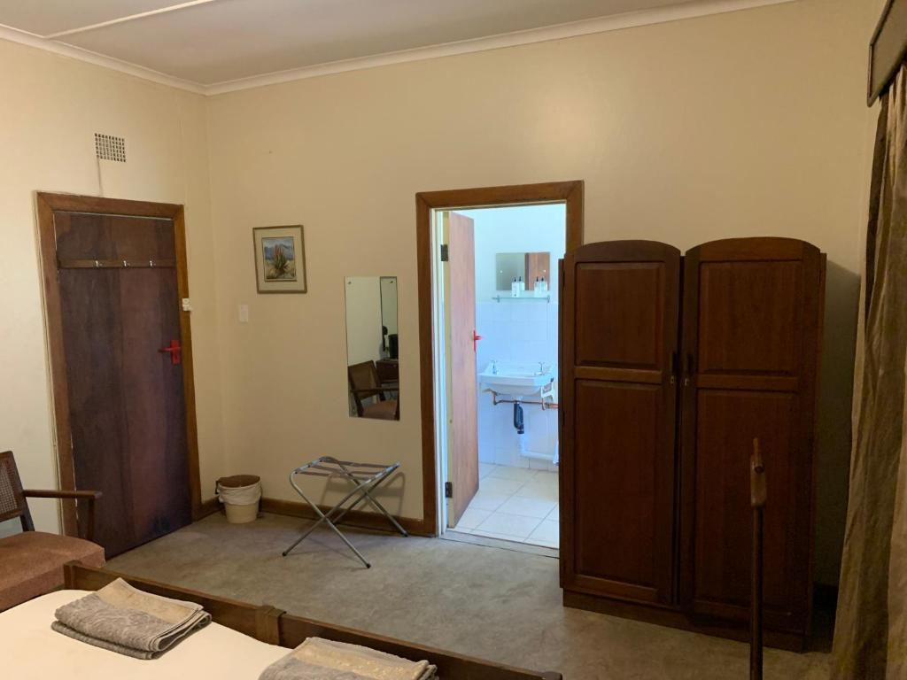 Postel nebo postele na pokoji v ubytování Hotel De Rust