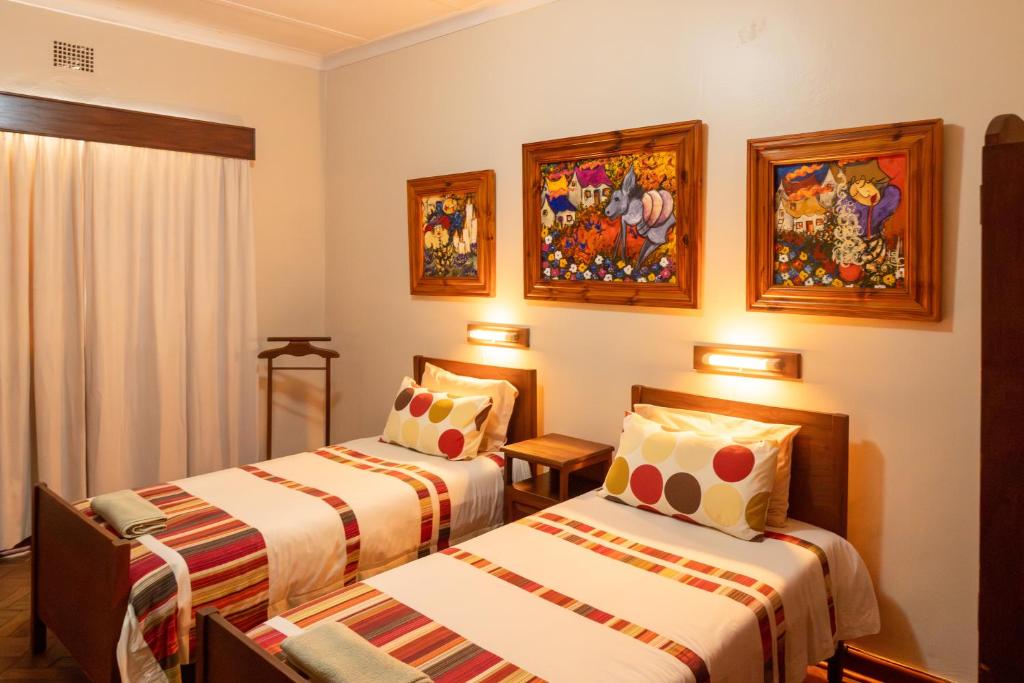 Postel nebo postele na pokoji v ubytování Hotel De Rust