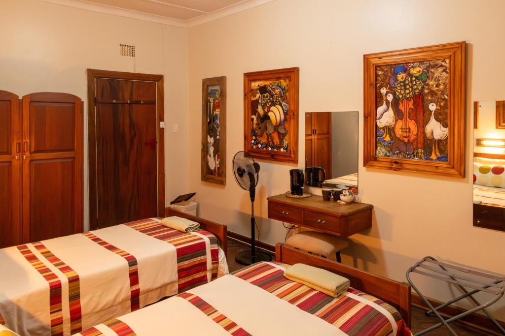 Postel nebo postele na pokoji v ubytování Hotel De Rust