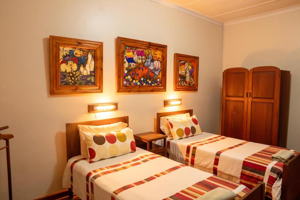 Postel nebo postele na pokoji v ubytování Hotel De Rust