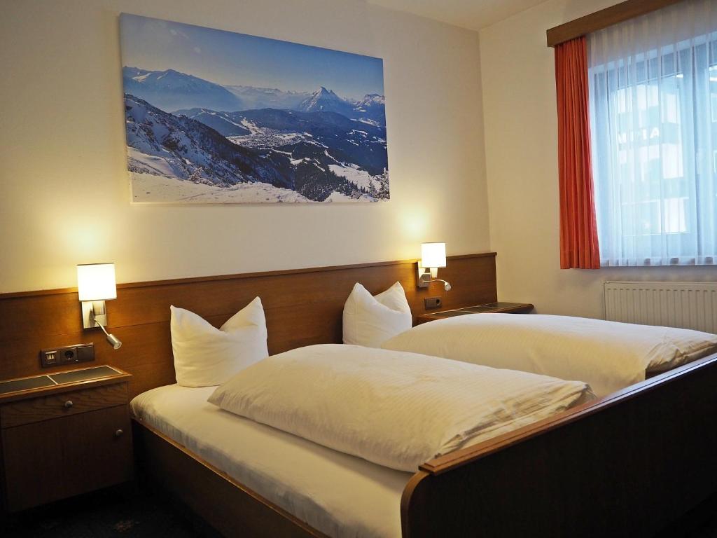 Postel nebo postele na pokoji v ubytování Hotel Egerthof