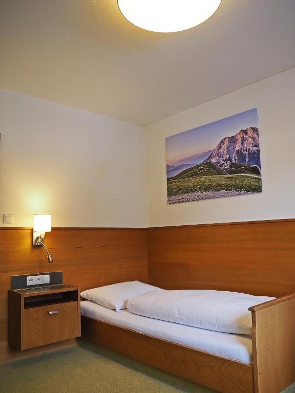 Postel nebo postele na pokoji v ubytování Hotel Egerthof