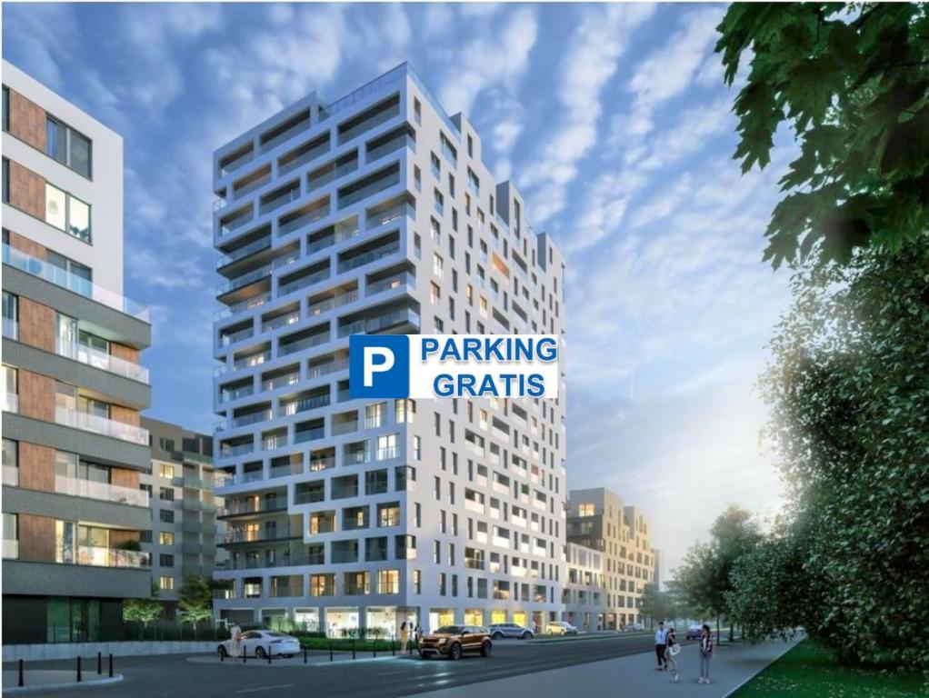 a rendering of a tall white building with a street sign at Vista Residence Premium II in Warsaw