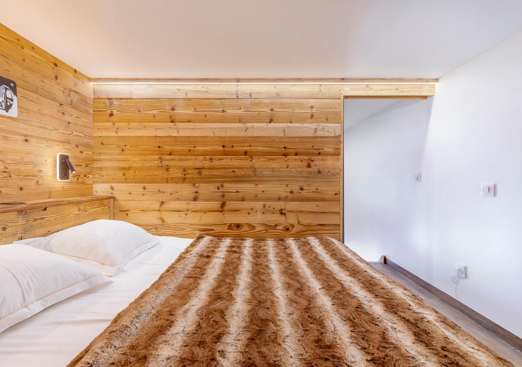 Postel nebo postele na pokoji v ubytování Val Thorens So Cocooon Silveralp 330