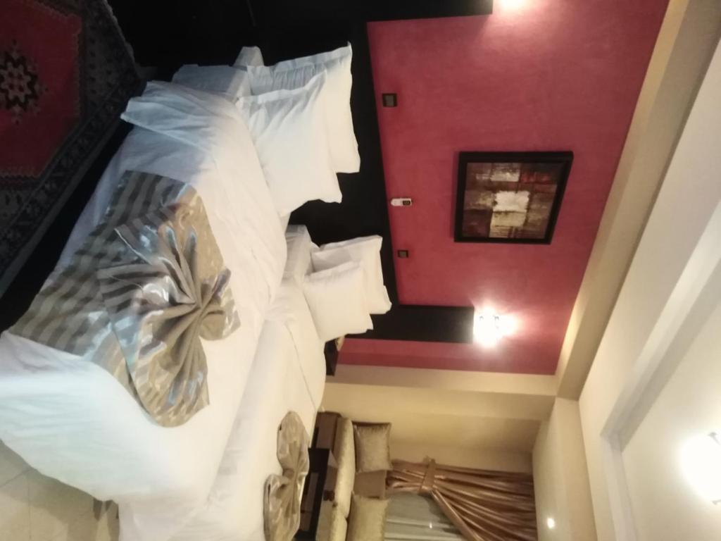 Postel nebo postele na pokoji v ubytování Suite Hotel Tilila