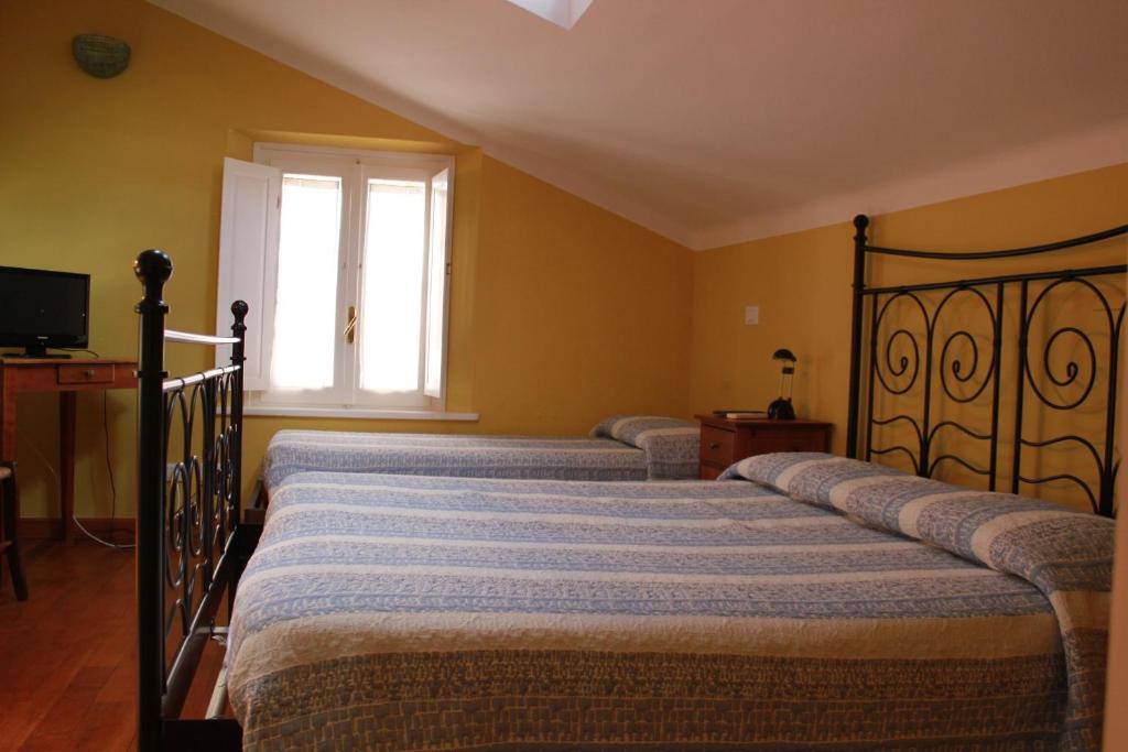 Кровать или кровати в номере B&B Al Borgo