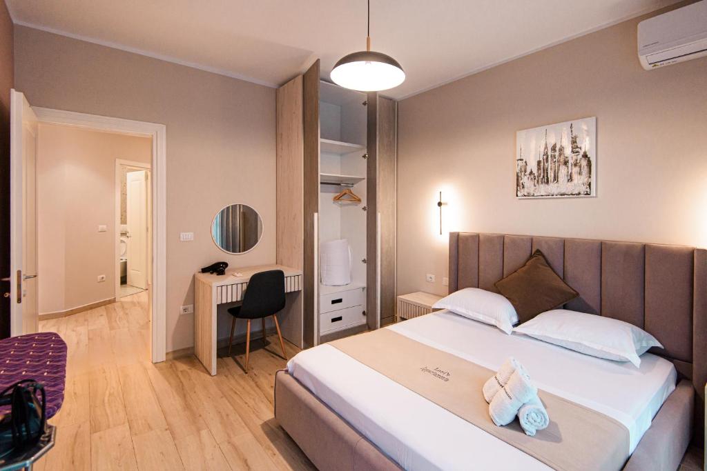 Łóżko lub łóżka w pokoju w obiekcie Loris Apartaments 204