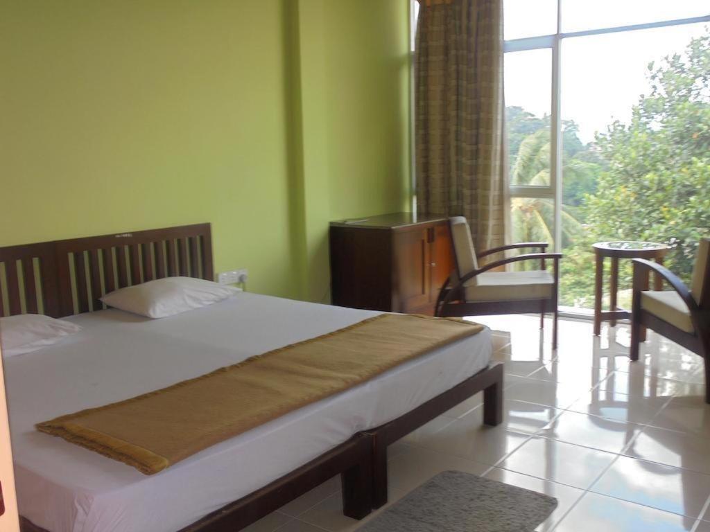 Postel nebo postele na pokoji v ubytování Suisse View Residence Kandy