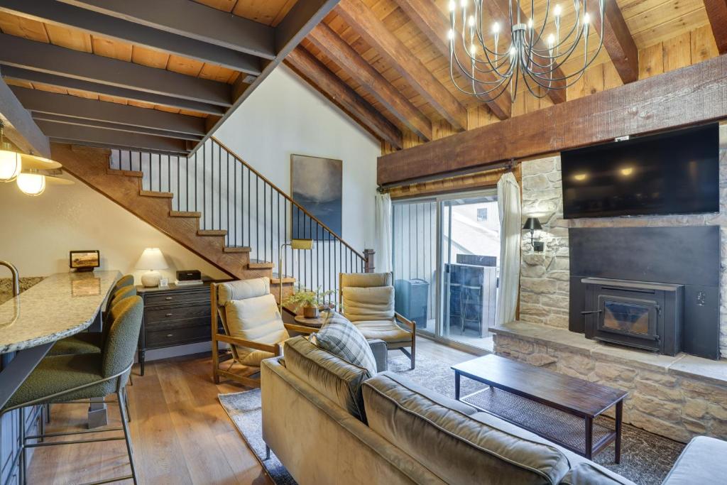 a living room with a couch and a fireplace at Mountain-View Condo in Brian Head with Private Sauna in Brian Head