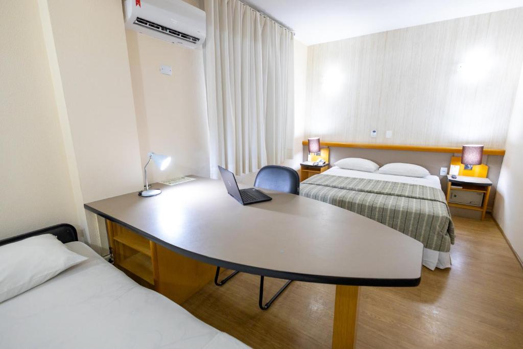Postel nebo postele na pokoji v ubytování Sables Hotel Guarulhos