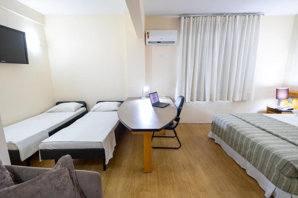 Postel nebo postele na pokoji v ubytování Sables Hotel Guarulhos