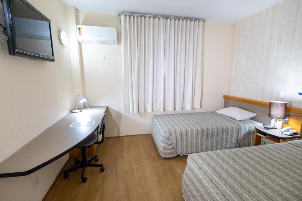 Postel nebo postele na pokoji v ubytování Sables Hotel Guarulhos