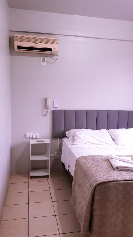 Postel nebo postele na pokoji v ubytování Hotel Ermitage