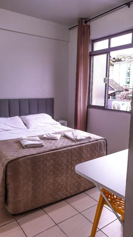 Postel nebo postele na pokoji v ubytování Hotel Ermitage