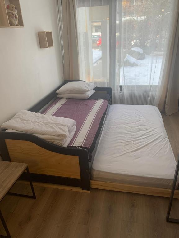 Posteľ alebo postele v izbe v ubytovaní Chez Greg les 2 ALPES