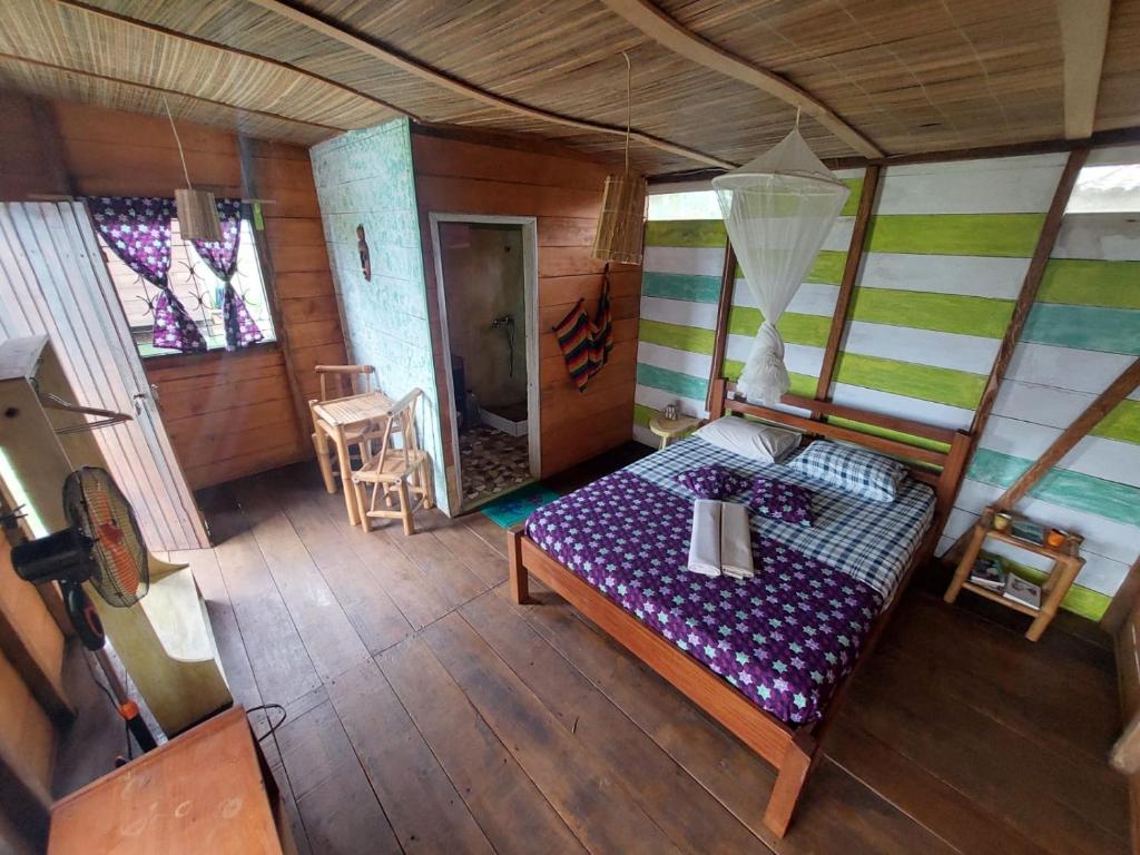 Postel nebo postele na pokoji v ubytování GENTE D'AQUI Ngê D'ai êê