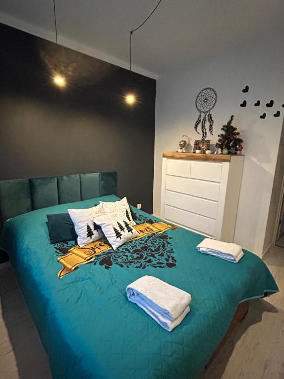 Tempat tidur dalam kamar di Apartament Terebelska P