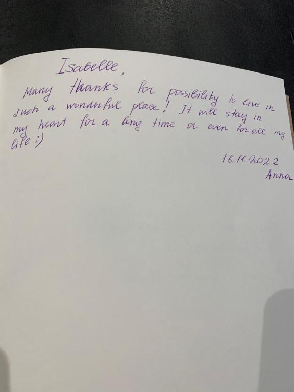 a handwritten note on a white piece of paper at La coccinelle in Noyarey