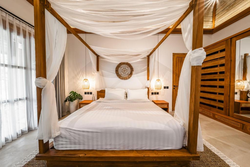 Ένα ή περισσότερα κρεβάτια σε δωμάτιο στο Orion Villa by DH Ubud