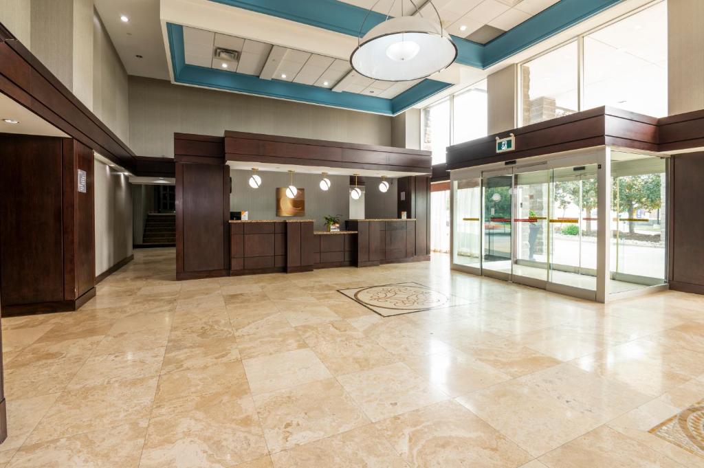 an empty lobby with a large room with a lobby at Comfort Inn & Conference Centre Toronto Airport in Toronto